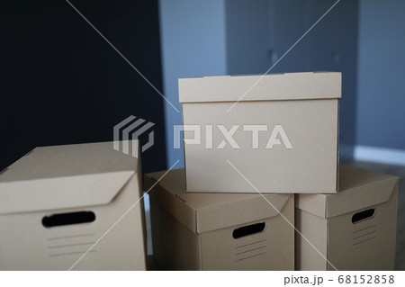 Close-up boxes stand near the front door of room Close-up boxes stand near the front door of room 68152858