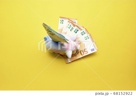 Pink Pig Money Box Isolated on a yellow background 68152922