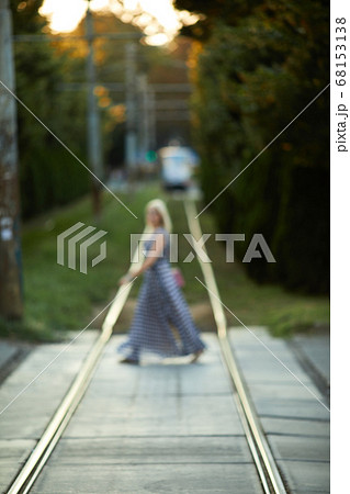 blurred girl crosses tram lines blurred girl crosses tram lines 68153138