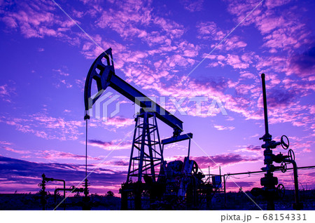 Petroleum concept. Oil pump rig. Oil and gas production. Oilfield site. Pump Jack are running. Drilling derricks for fossil fuels output and crude oil production. Global crisis. War on oil prices. Petroleum concept. Oil pump rig. Oil and gas production. Oilfield site. Pump Jack are running. Drilling derricks for fossil fuels output and crude oil production. Global crisis. War on oil prices. 68154331