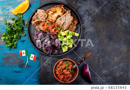 Yucatan Mexican Food Pork POC CHUC poc chuck. Pork marinaded in orange juice served with avocado 68155643
