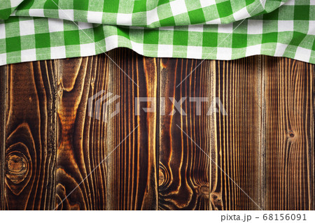 cloth napkin at old wooden board table background 68156091