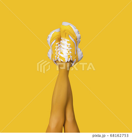 New Yellow female sneakers on long slender woman New Yellow female sneakers on long slender woman 68162753