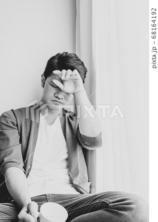 Young Asian man wearing casual clothes and having 68164192