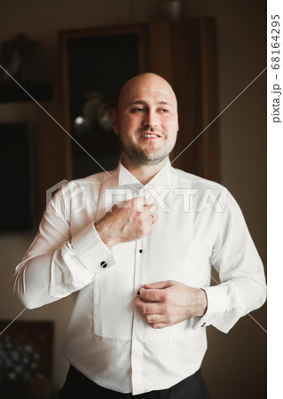 Young handsome man relaxing at his apartment in a hotel after business meeting Young handsome man relaxing at his apartment in a hotel after business meeting 68164295
