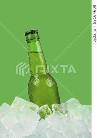 One bottle of cold lager beer on ice cubes One bottle of cold lager beer on ice cubes 68164609