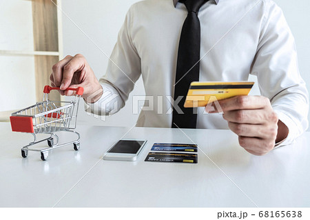 Man using credit card register security code Man using credit card register security code 68165638