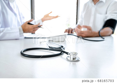 Doctor being measuring examination patient and 68165703
