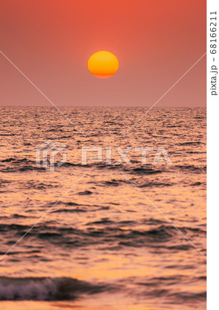 Natural Color Sunset Sunrise Sky Over Sea. Seascape With Shining Setting Sun On Sea Horizon Natural Color Sunset Sunrise Sky Over Sea. Seascape With Shining Setting Sun On Sea Horizon 68166211