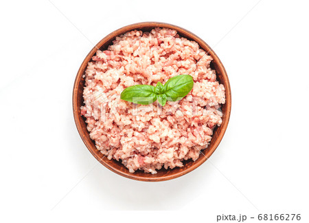 Raw minced meat in bowl on wooden table 68166276