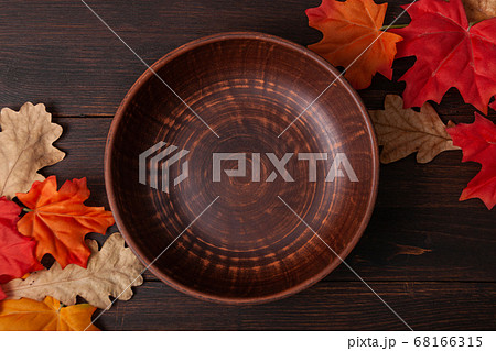 Autumn maple leaves on brown wooden table 68166315