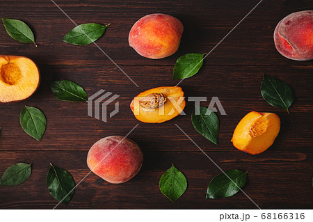Peach or nectarine and peach slice with leaf on 68166316
