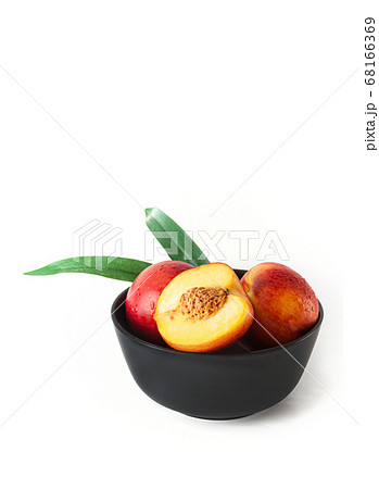 Peach or nectarine and peach slice with leaf on 68166369