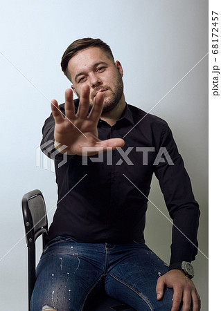 Dissenting Male Shows The Palm His Hand As A Pretty, Stop Gesture Dissenting Male Shows The Palm His Hand As A Pretty, Stop Gesture 68172457