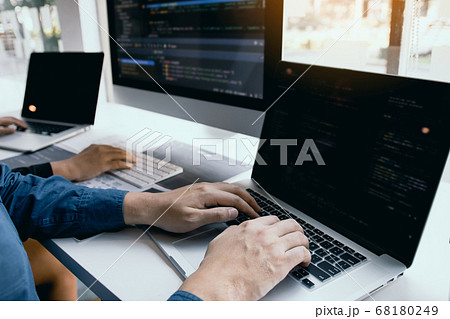 Two software developers are analyzing together 68180249