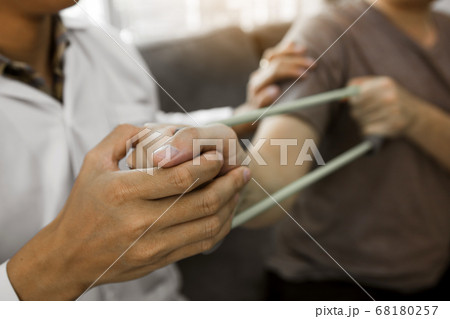 Close up hand patient doing stretching exercise 68180257