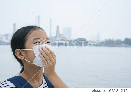 Asian thai girl wearing protective mask or Asian thai girl wearing protective mask or 68184215