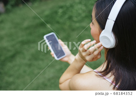 Woman enjoy music with wireless headphone. Woman enjoy music with wireless headphone. 68184352