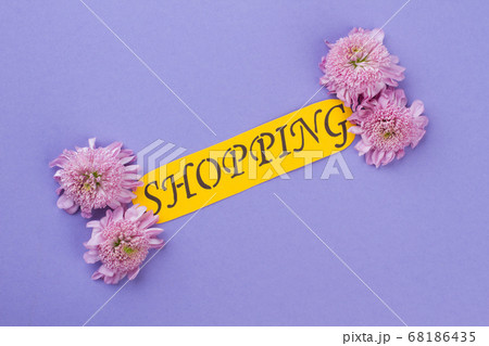 Word shopping and flowers isolated on purple background. 68186435