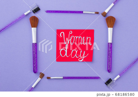 Women day written on a red paper. 68186580
