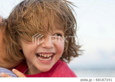 smiling 5 year old boy at the beach 68187341