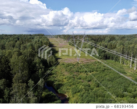 Aerial top down view of the power lines located in the forest. Aerial top down view of the power lines located in the forest. 68193456