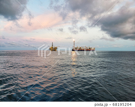 FPSO tanker vessel near Oil Rig platform. Offshore oil and gas industry FPSO tanker vessel near Oil Rig platform. Offshore oil and gas industry 68195204