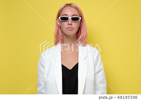 Fashion portrait of serious woman dressed as a spy 68195506