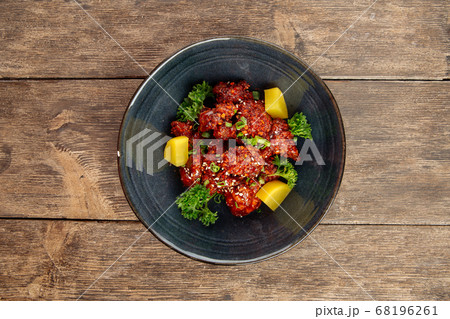 Asian marinated chicken in spicy sauce with daikon 68196261
