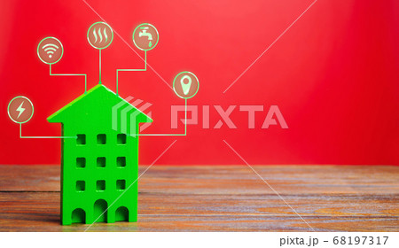 Miniature wooden house and symbols of public utilities. Choosing a house to buy, assessing the cost and condition of the building, location in the city. Repair and renovation, maintenance services Miniature wooden house and symbols of public utilities. Choosing a house to buy, assessing the cost and condition of the building, location in the city. Repair and renovation, maintenance services 68197317