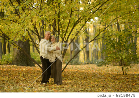 Happy senior woman and man in park 68198479
