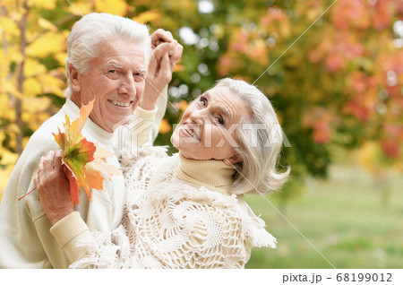 Happy senior couple dancing in summer park 68199012