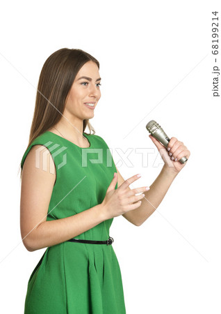 Young woman with microphone on white background Young woman with microphone on white background 68199214