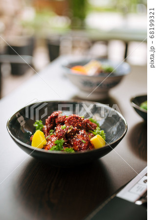 Asian marinated chicken in spicy sauce with daikon 68199321