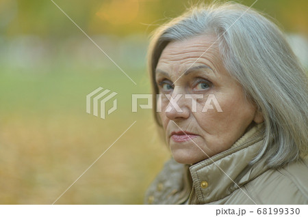 Portrait of sad, thoughtful senior woman in park 68199330