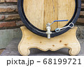 Wooden wine barrel with a tap. traditional concept of winemaking and wine tasting. 68199721