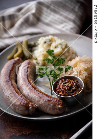german sausage plate with mustard, potato salad 68199822
