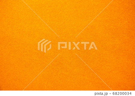 Bright solid color background. Empty orange surface with fine texture. Preparation for designer or Bright solid color background. Empty orange surface with fine texture. Preparation for designer or 68200034