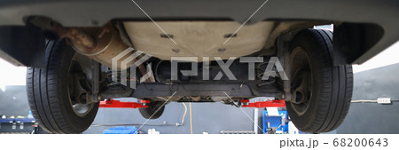 Lift car on lift for inspection car service center Lift car on lift for inspection car service center 68200643
