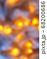 Background from blurry light lights of fir-tree garland on dark. Copy space 68200686