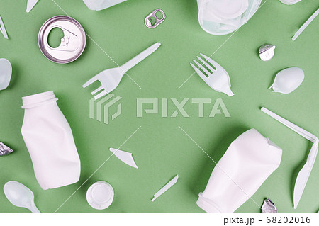 Eco plastic recycling concept. Single use plastics on green background. 68202016
