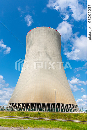Cooling tower of nuclear power plant. On sunny day with blue sky and white clouds 68202057