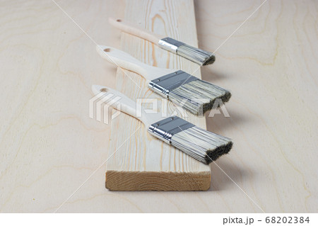DIY. Brushes on wooden background DIY. Brushes on wooden background 68202384