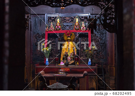Ho Chi Minh City, Vietnam: one of the altars of Ha Chuong Hoi Quan pagoda with statue of Hanuman and wooden carving depicting army of monkeys. The temple located in Cho Lon, Chinatown 68202495