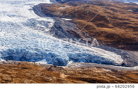 Greenlandic ice cap melting glacier with tundra 68202956
