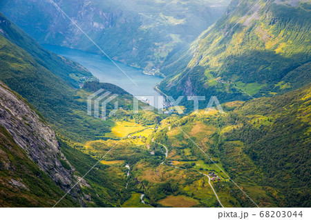 View to the Geiranger fjord with green valley 68203044