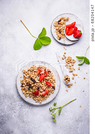 Homemade granola with fresh strawberry Homemade granola with fresh strawberry 68204147