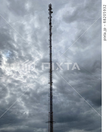 cell tower against a gloomy sky 68205932