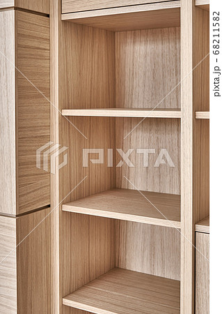 Wooden bookshelves. Wooden bookcases and wall panels made of oak veneered MDF Wooden bookshelves. Wooden bookcases and wall panels made of oak veneered MDF 68211582