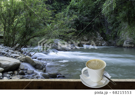 Isolated Hot coffee Put a glass of white with a casual break from work  background waterfall 68215553